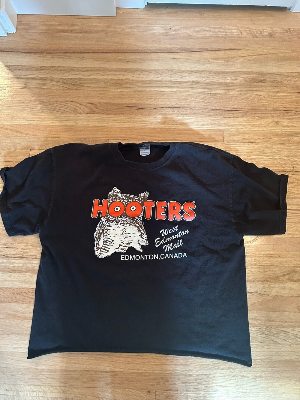 Vintage Hooters Black Graphic Tee with Orange Logo